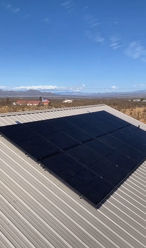 Sleek black solar array on a metal roof